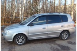 Дефлекторы окон Kia Carens 1